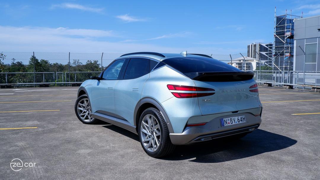 Genesis GV60 AWD rear in city car park