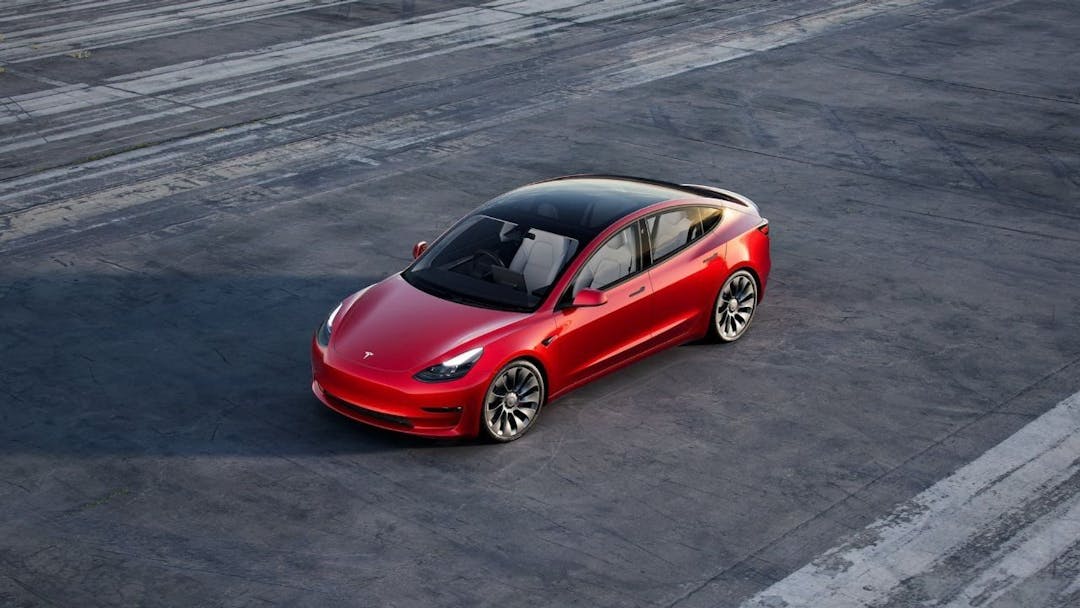 Red Tesla Model 3 Performance on track