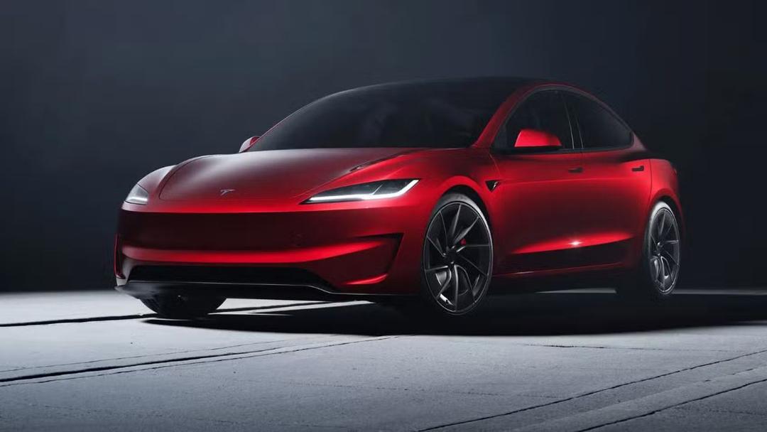 2024 Tesla Model 3 Performance in red three quarter view parked