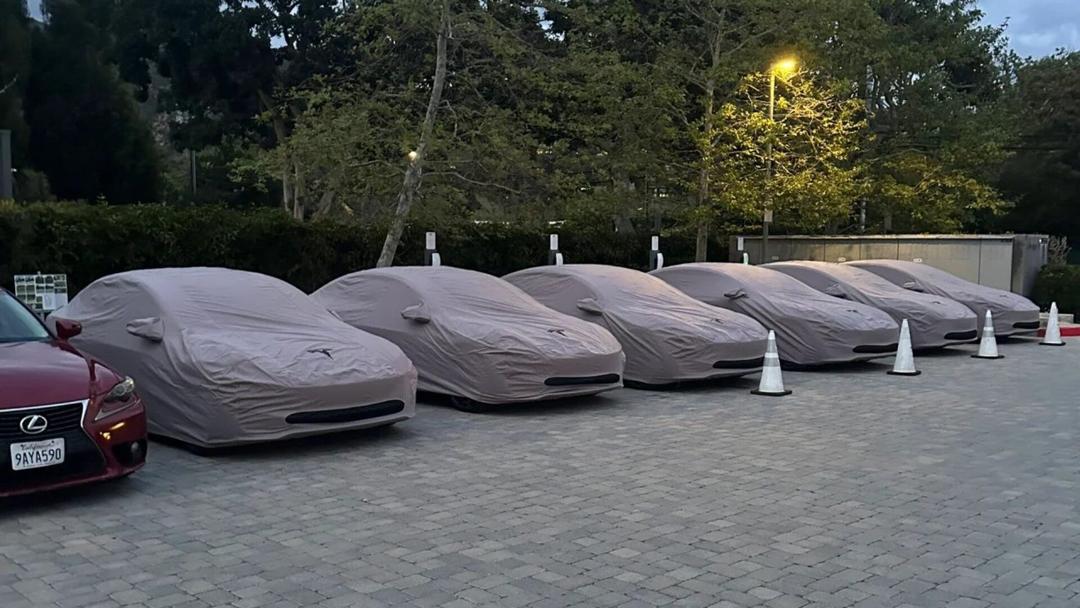 Tesla Model 3 Performance covered parked in a row leaked photo