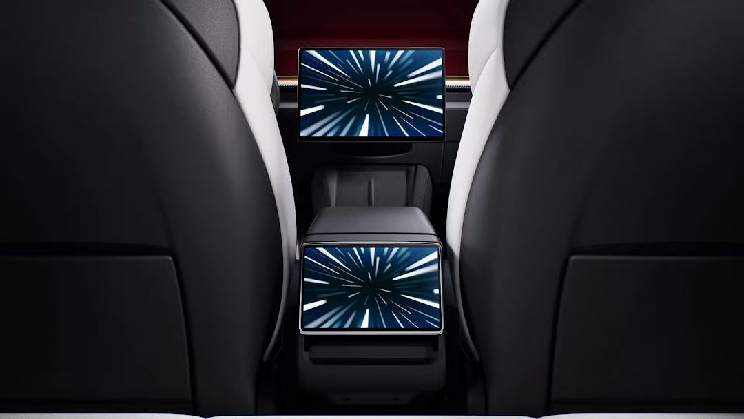 2024 Tesla Model 3 Performance infotainment screens from rear seat