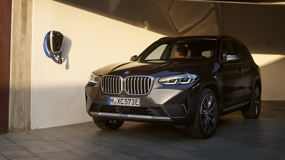 BMW X3 xDrive30e in grey parked three quarter view