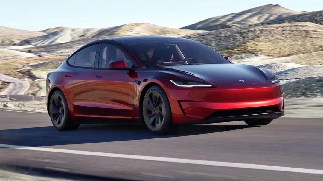 2024 Tesla Model 3 Performance in red three quarter view with hill background