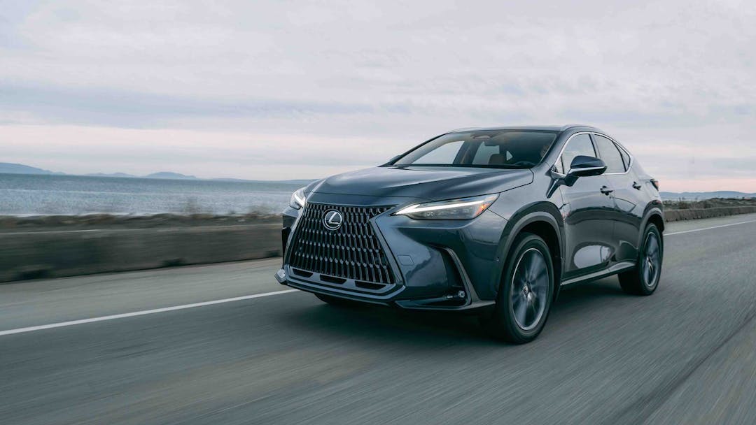 Lexus NH PHEV in grey driving on road three quarter view