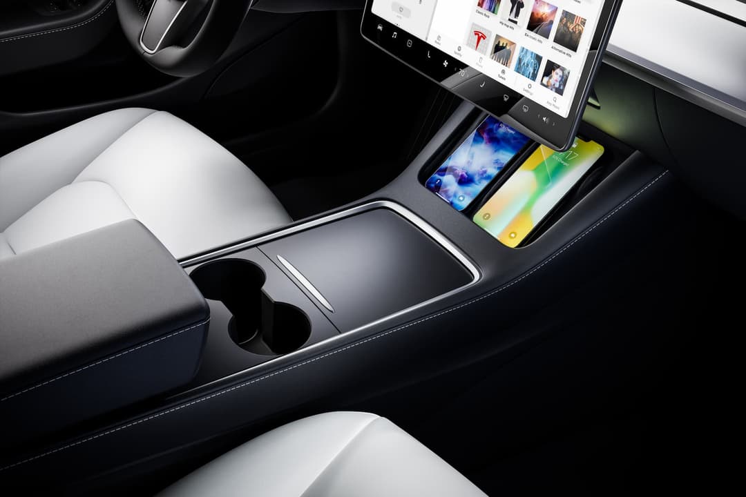 Tesla Model 3 centre console and wireless charging pad interior Tesla Model 3 centre console and wireless charging pad interior
