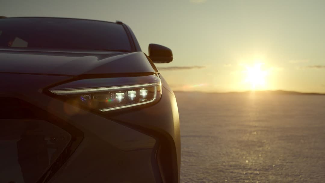 2024 Subaru Solterra front view zoomed in with sunrise background 2024 Subaru Solterra front view zoomed in with sunrise background