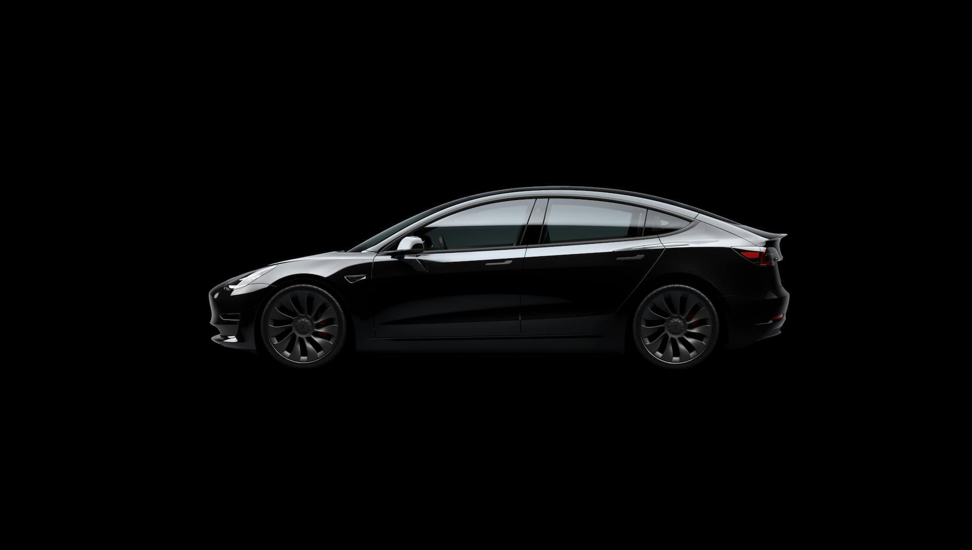 Black Tesla Model 3 Performance side with black background