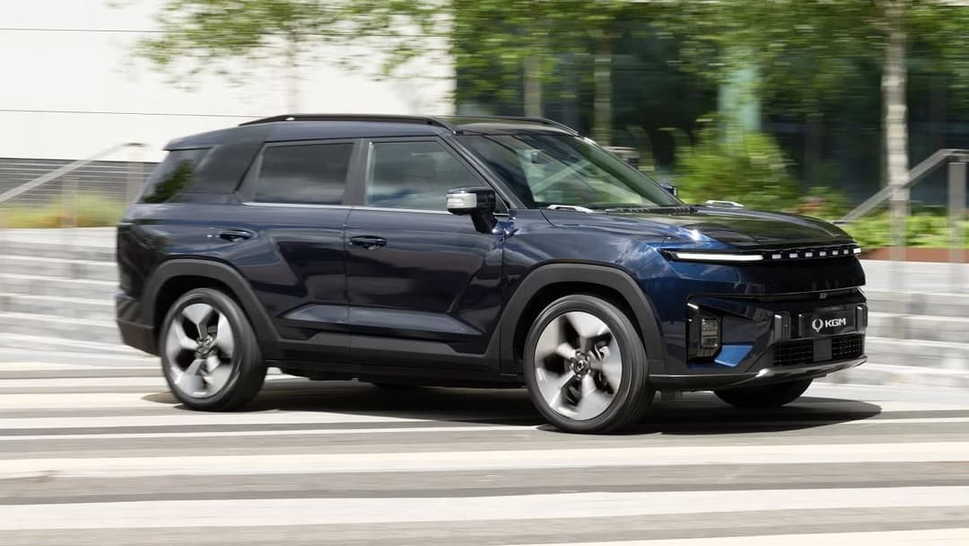 KGM Torres EVX rear three-quarter view showing LED taillights, charging port, and SUV proportions KGM Torres EVX rear three-quarter view showing LED taillights, charging port, and SUV proportions