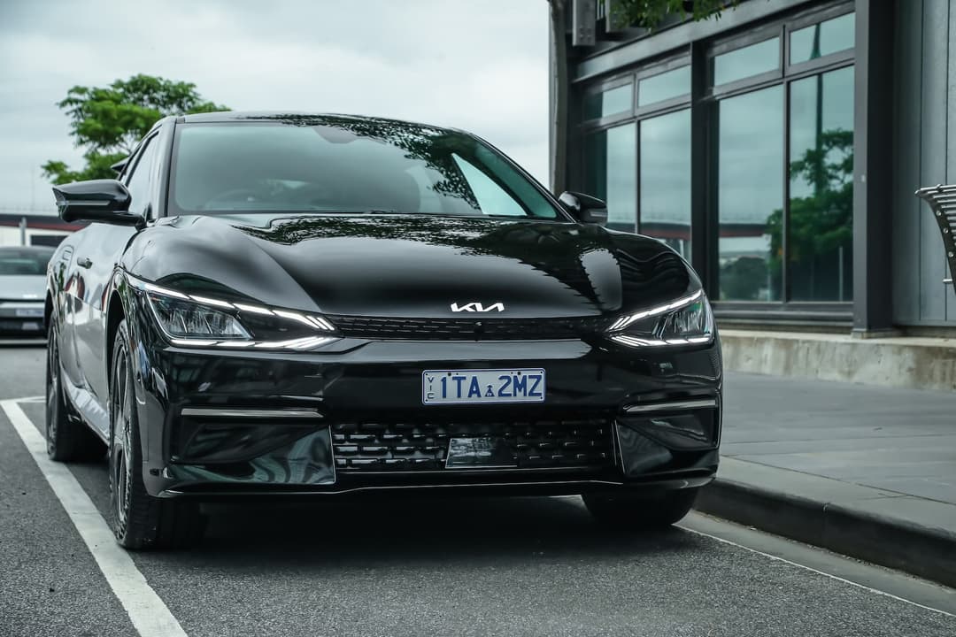 Black Kia EV6 GT-Line RWD parked beside city street Black Kia EV6 GT-Line RWD parked beside city street
