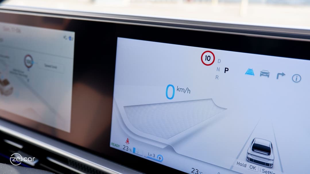 Hyundai Ioniq 6 instrument display and person driving
