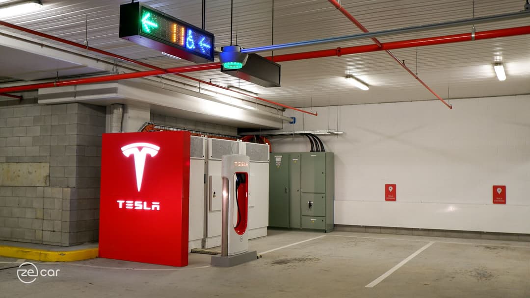 Indooroopilly Shopping Centre red Tesla logo wall and V3 Supercharger station Indooroopilly Shopping Centre red Tesla logo wall and V3 Supercharger station