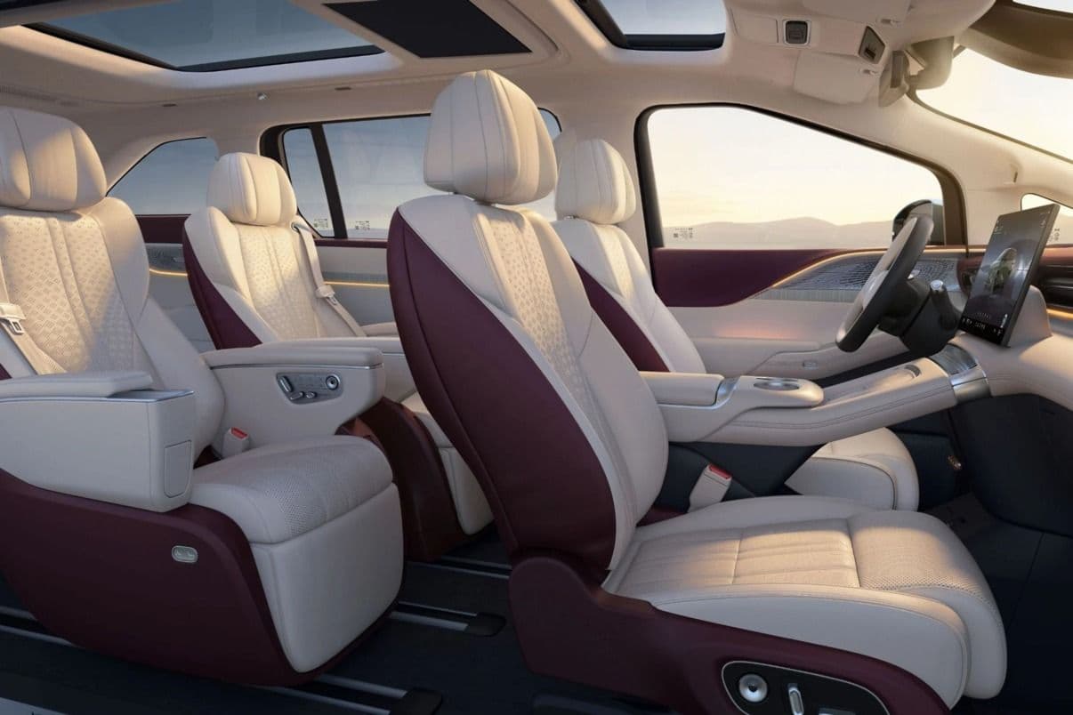 XPeng X9 interior showing seven-seat layout and large infotainment screen XPeng X9 interior showing seven-seat layout and large infotainment screen