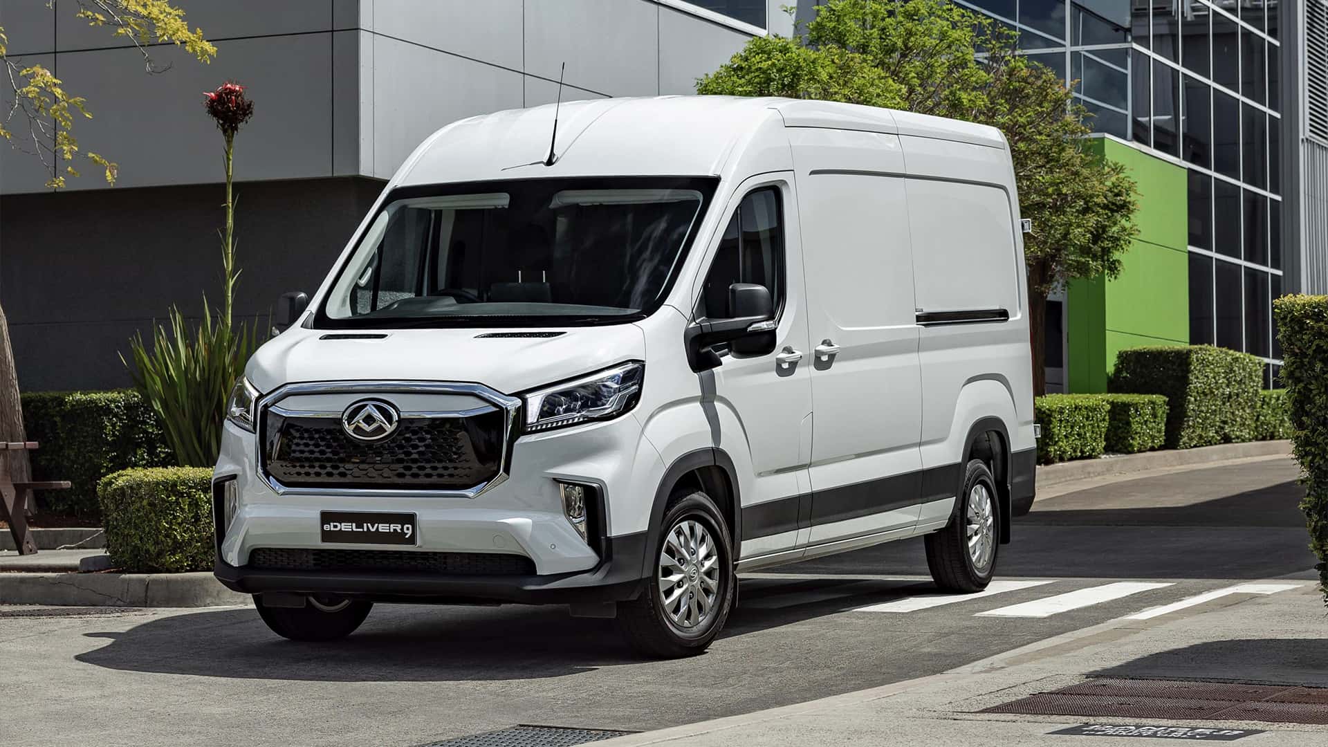White LDV e-Deliver 9 angled front view parked in pedestrian lane White LDV e-Deliver 9 angled front view parked in pedestrian lane