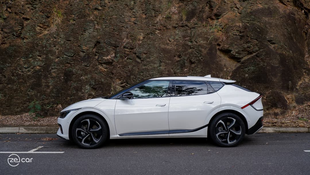 White Kia EV6 GT-Line on side of rocks White Kia EV6 GT-Line on side of rocks