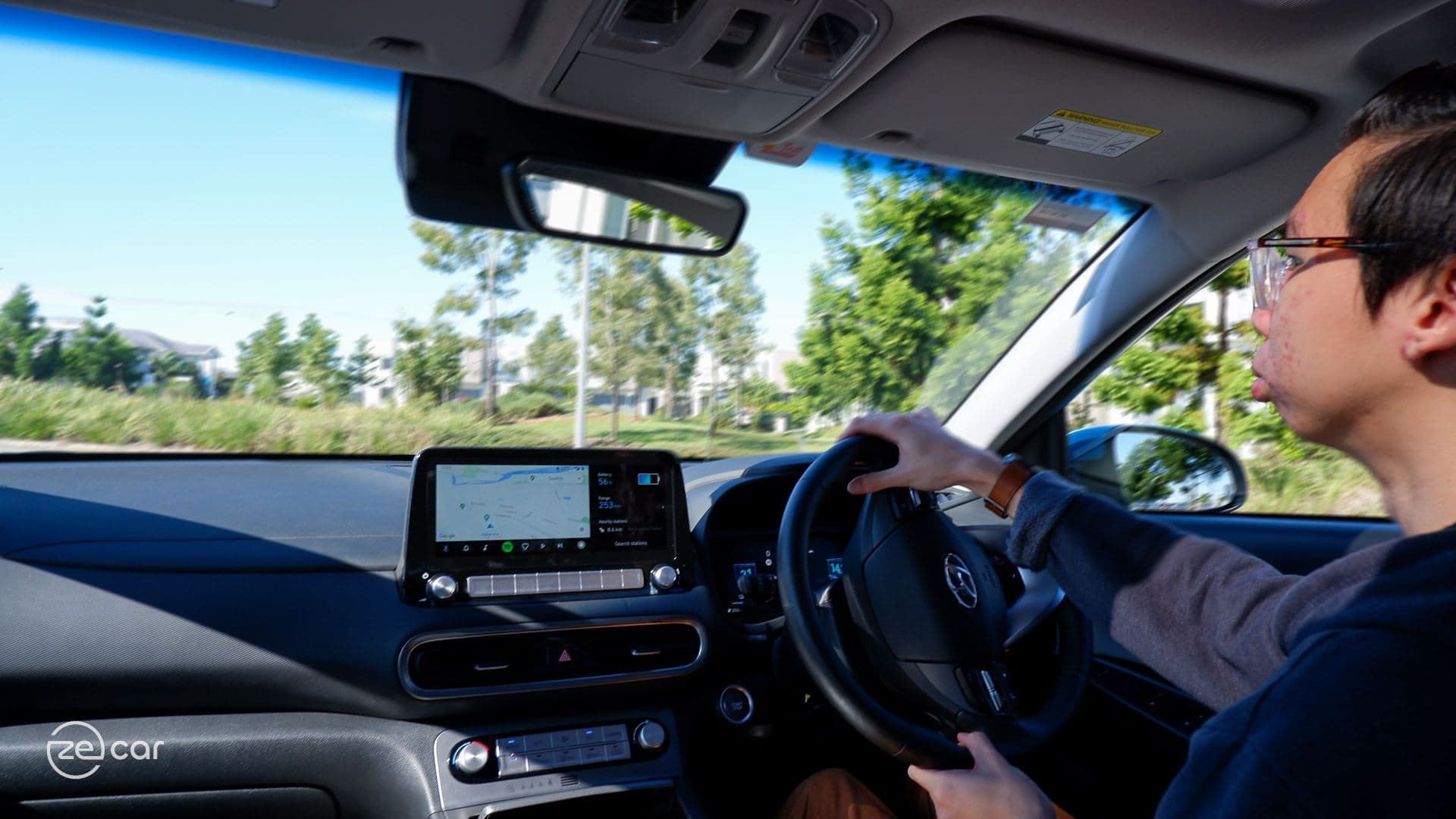 Person driving Hyundai Kona Electric interior dashboard view Person driving Hyundai Kona Electric interior dashboard view