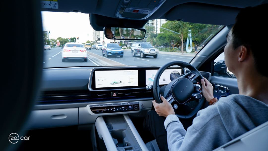 Man driving Hyundai Ioniq 6 with BYD Atto 3 opposite Man driving Hyundai Ioniq 6 with BYD Atto 3 opposite