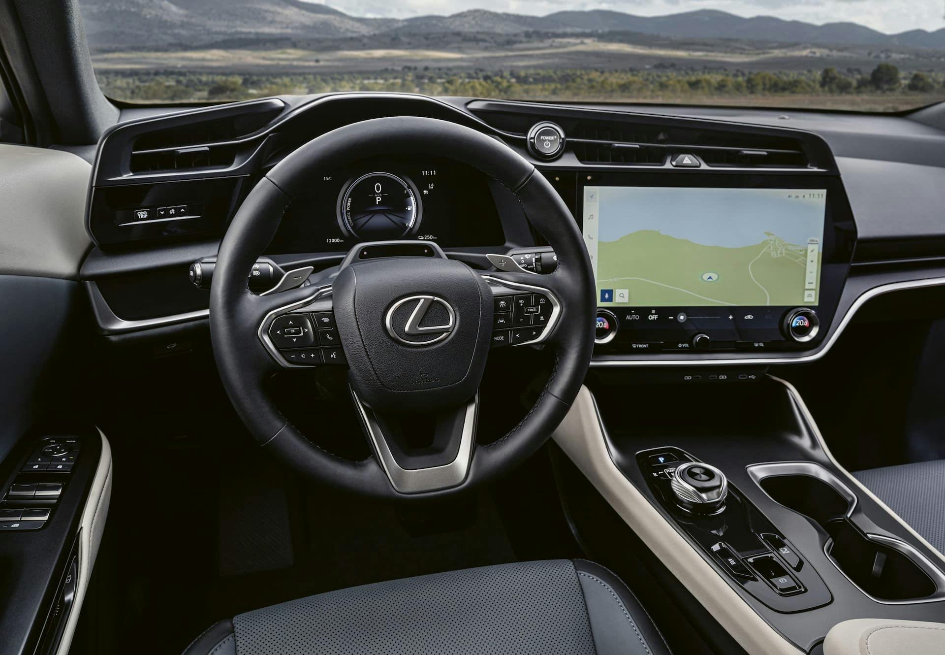 Lexus RZ interior with three-spoke steering wheel and touchscreen displaying map