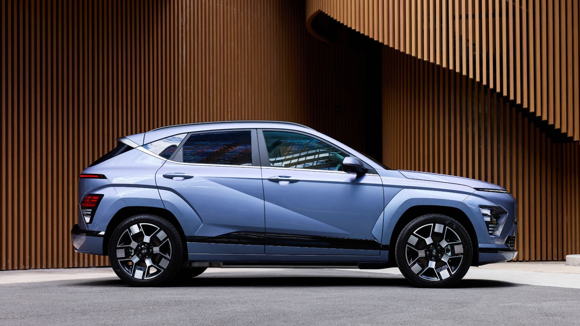 Hyundai Kona in side view parked modern building background Hyundai Kona in side view parked modern building background