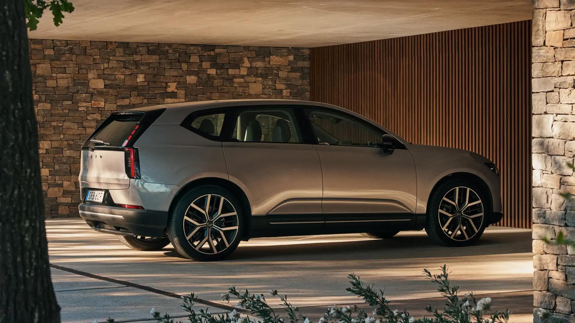2027 Volvo EX60 rear three-quarter exterior view showing taillights and alloy wheels 2027 Volvo EX60 rear three-quarter exterior view showing taillights and alloy wheels