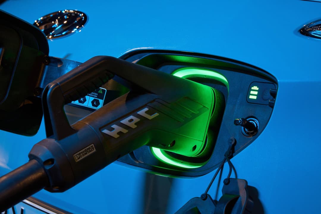 Blue Hyundai Kona Electric charging port and HPC plug Blue Hyundai Kona Electric charging port and HPC plug
