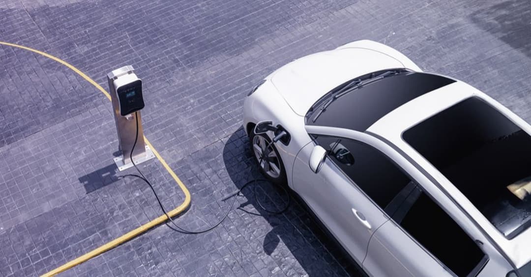 EV getting charged from a charging station EV getting charged from a charging station