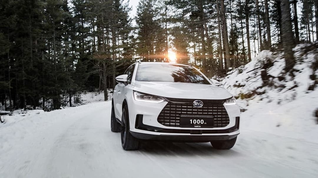 BYD Tang EV SUV driving on snow BYD Tang EV SUV driving on snow