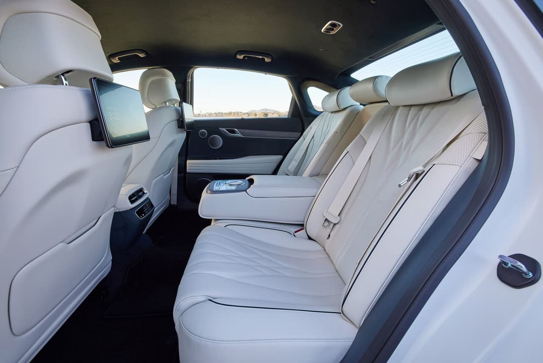 Genesis Electrified G80 white interior rear row Genesis Electrified G80 white interior rear row