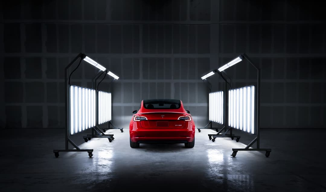 Red Tesla Model 3 in factory paint body inspection Red Tesla Model 3 in factory paint body inspection