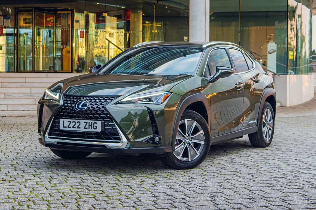 Lexus UX 300e front view parked on brick road Lexus UX 300e front view parked on brick road