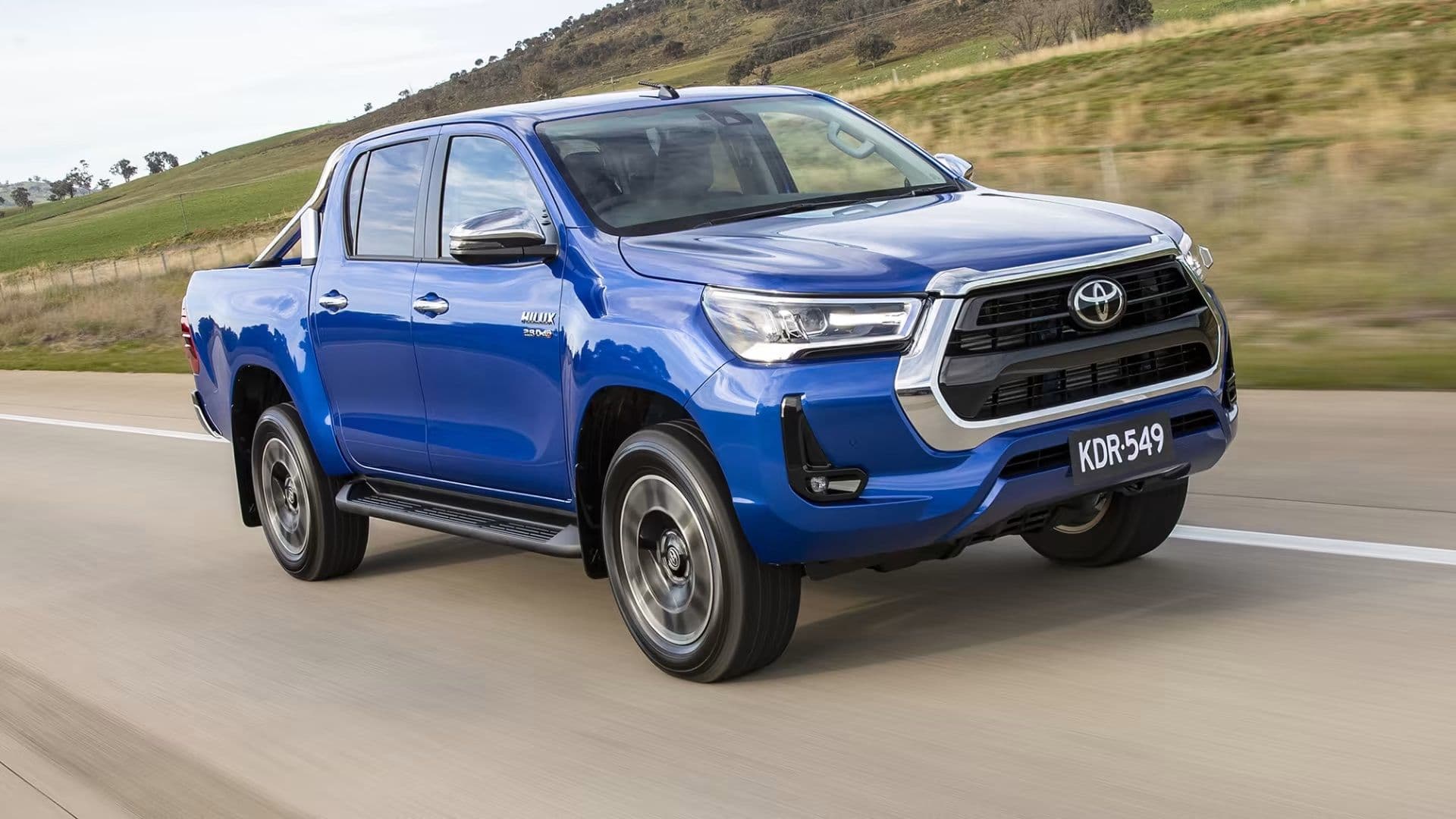 Blue Toyota Hilux on the road Blue Toyota Hilux on the road
