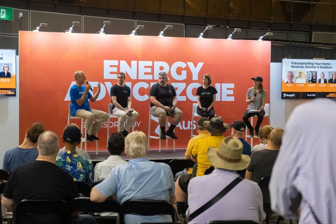 EV experts discussing on stage EV experts discussing on stage