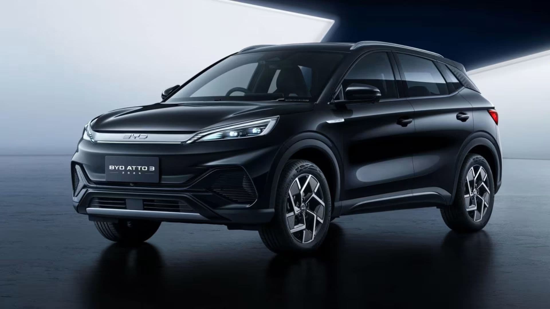 2025 BYD Atto3 in Cosmos Black three quarter view parked with white light background 2025 BYD Atto3 in Cosmos Black three quarter view parked with white light background