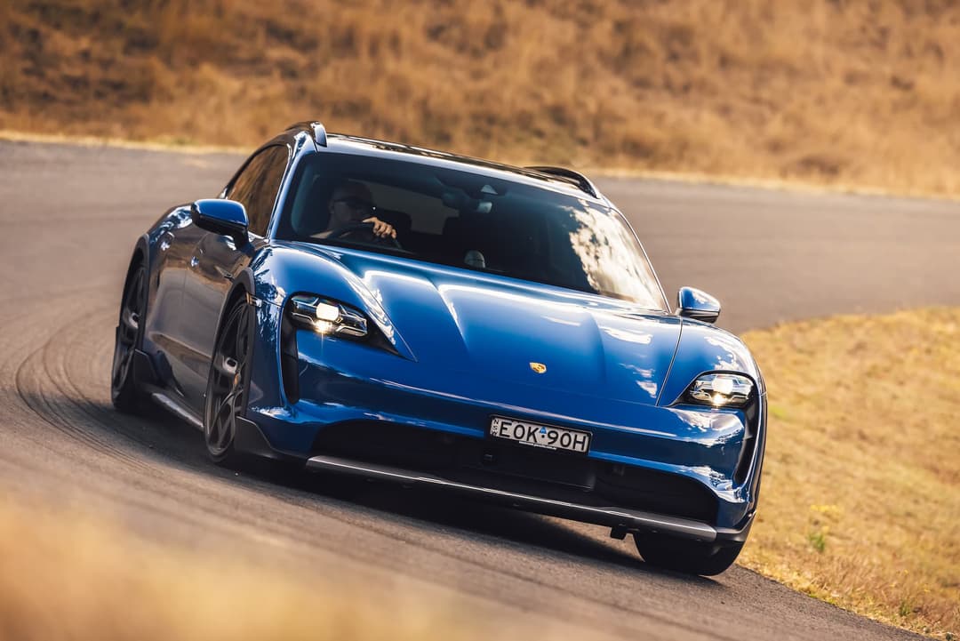 Porsche Taycan Cross Turismo wagon EV driving corner Porsche Taycan Cross Turismo wagon EV driving corner