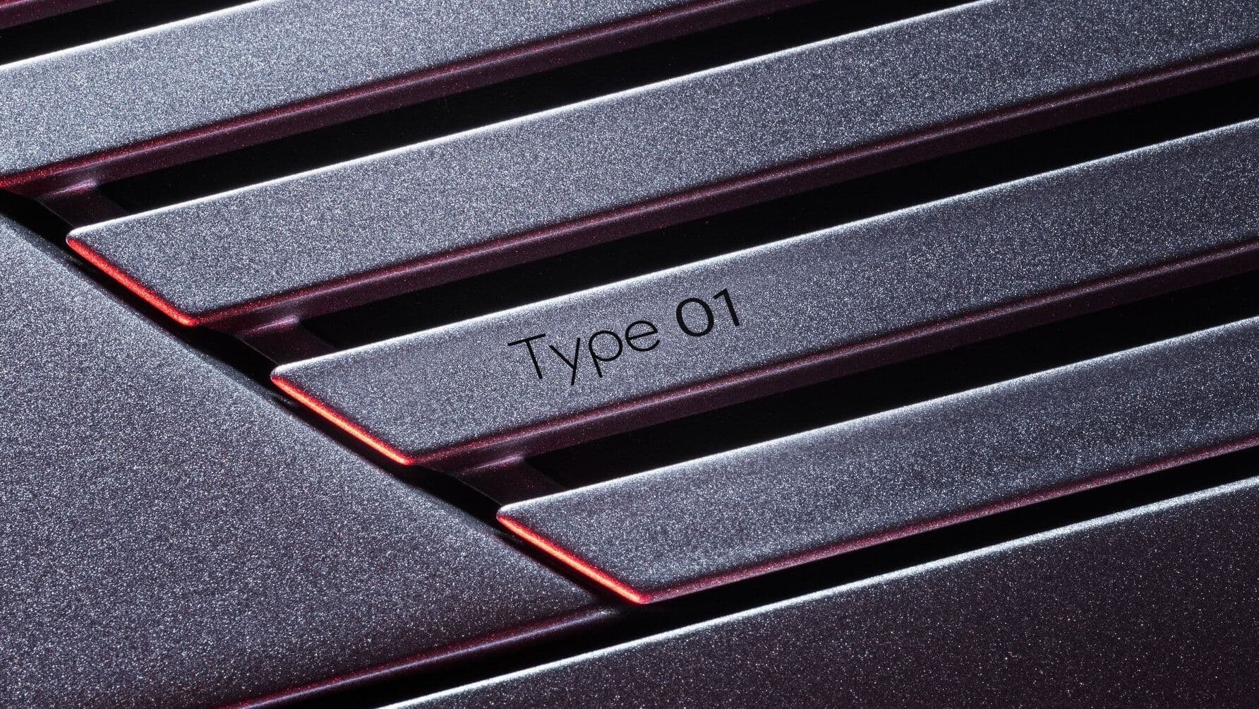 Jaguar Type 01 name badge on the bonnet strikethrough motif Jaguar Type 01 name badge on the bonnet strikethrough motif