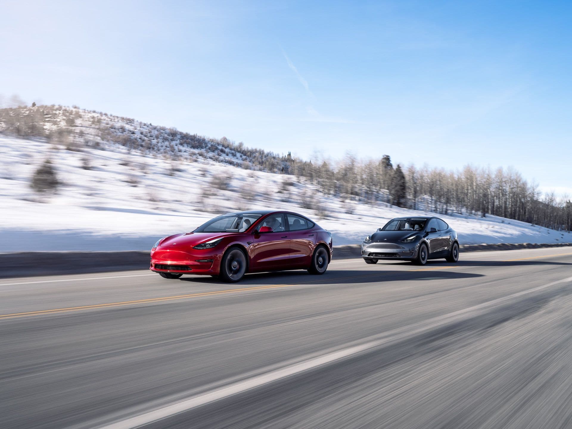 Tesla Model 3 and Model Y driving in snowy weather Tesla Model 3 and Model Y driving in snowy weather