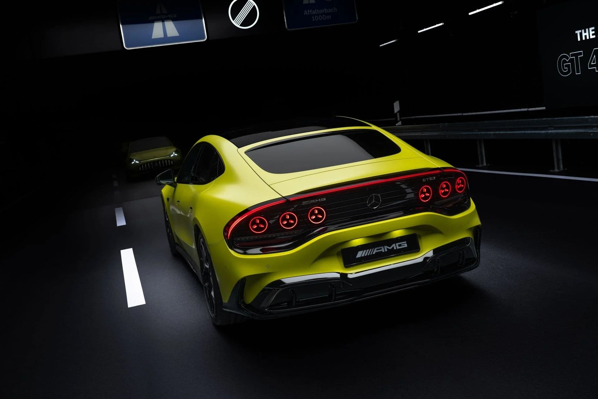 Mercedes-AMG GT EV rear view showing six circular tail-lights and active spoiler Mercedes-AMG GT EV rear view showing six circular tail-lights and active spoiler