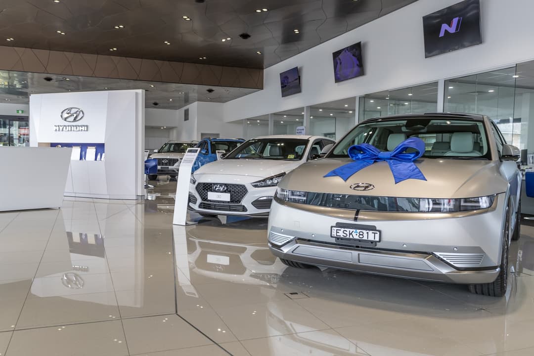 Hyundai Ioniq 5 with ribbon in showroom floor Hyundai Ioniq 5 with ribbon in showroom floor