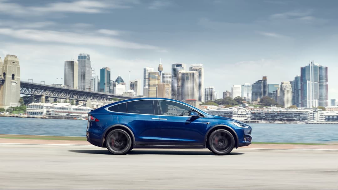 Blue Tesla Model X driving in Sydney Blue Tesla Model X driving in Sydney