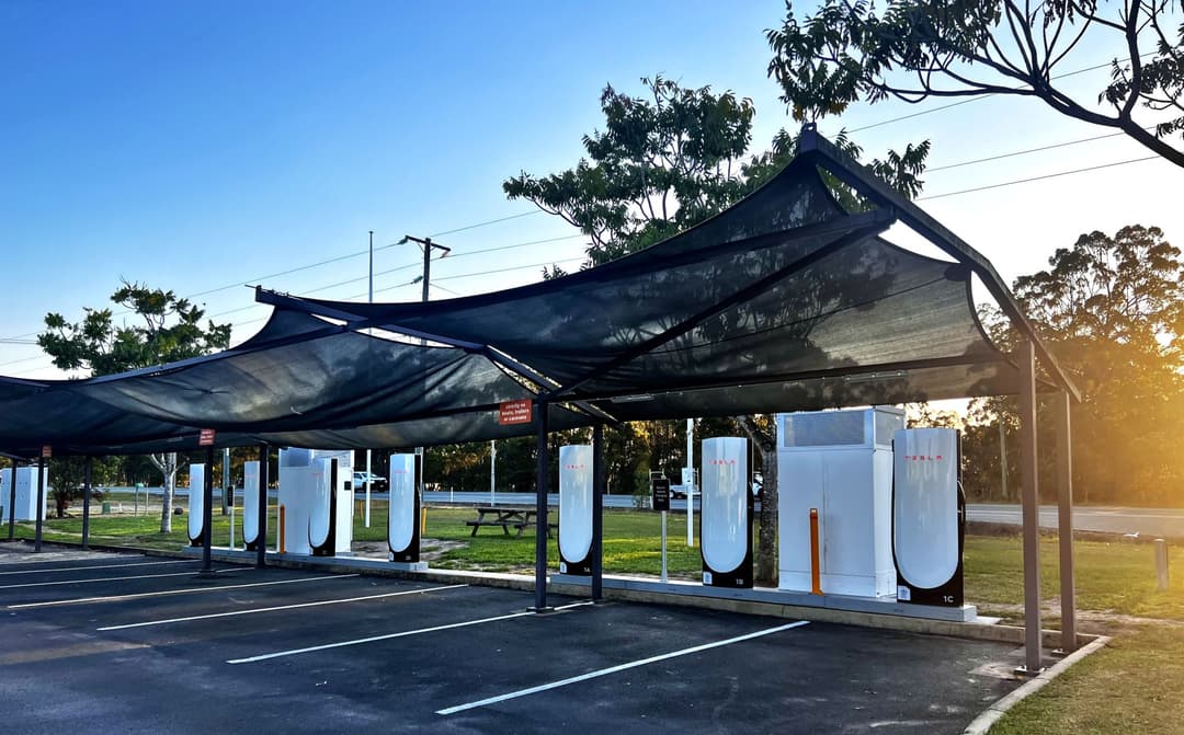 Tesla Supercharger station in Australia with multiple charging stalls available for all EV brands Tesla Supercharger station in Australia with multiple charging stalls available for all EV brands