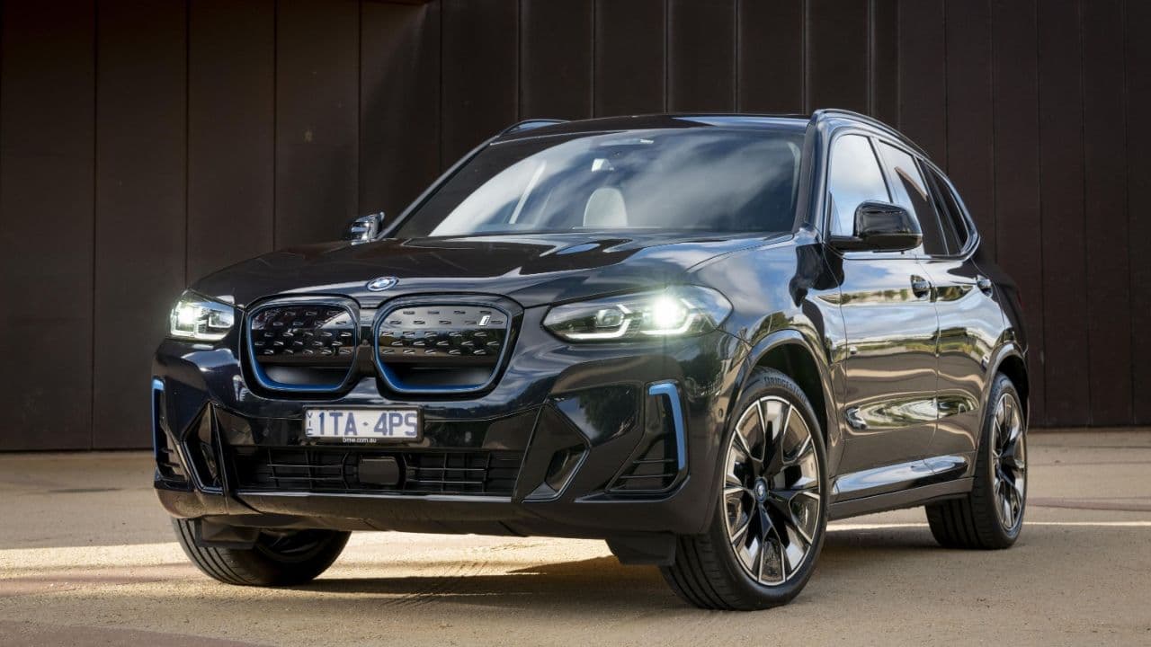 BMW iX3 parked outdoors front view BMW iX3 parked outdoors front view