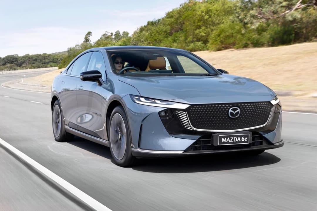 Mazda 6e rear three-quarter view showing coupe silhouette Mazda 6e rear three-quarter view showing coupe silhouette