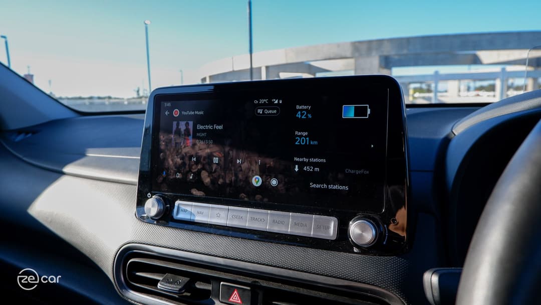Hyundai Kona Electric touchscreen with Android Auto 'Electric Feel' music displayed and battery percentage Hyundai Kona Electric touchscreen with Android Auto 'Electric Feel' music displayed and battery percentage
