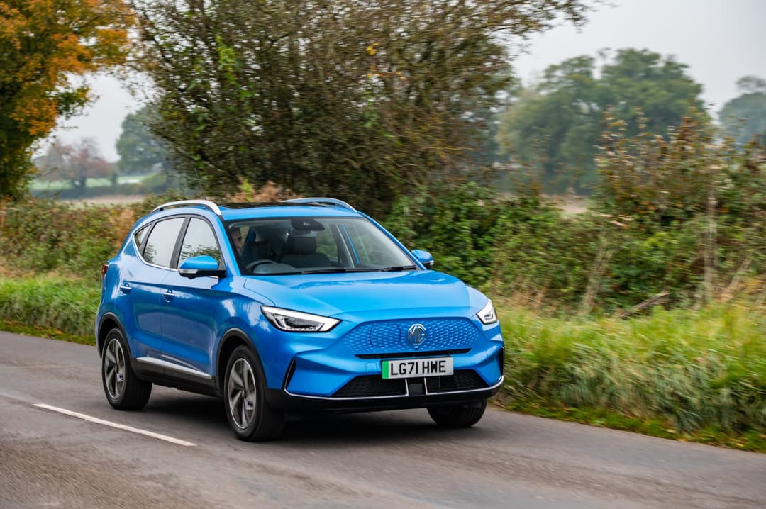 Blue MG ZS EV electric SUV driving Blue MG ZS EV electric SUV driving
