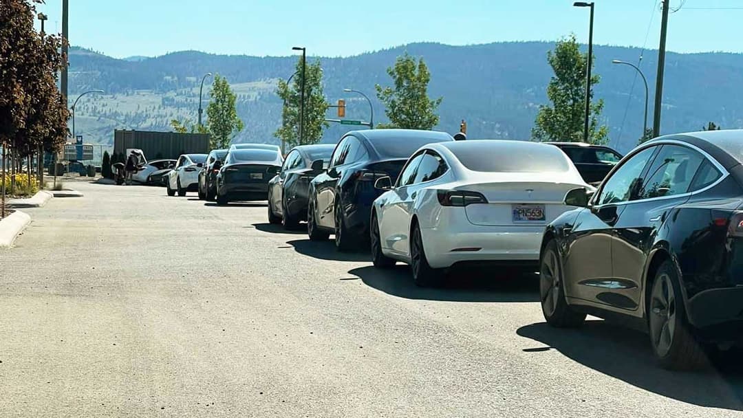 Tesla cars waiting for charging stations Tesla cars waiting for charging stations