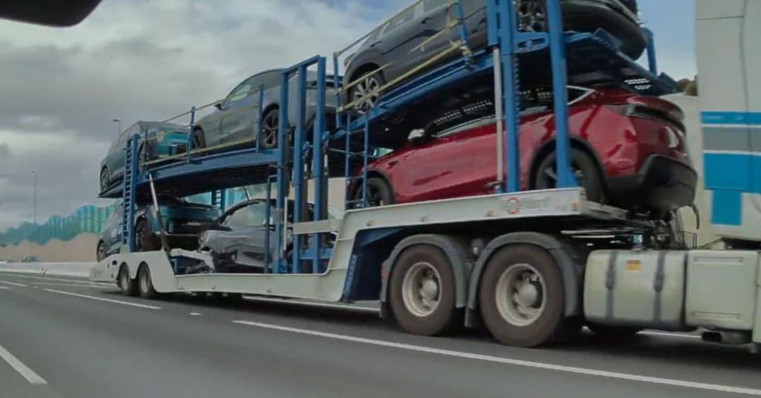 teslas being shipped on cargo truck teslas being shipped on cargo truck