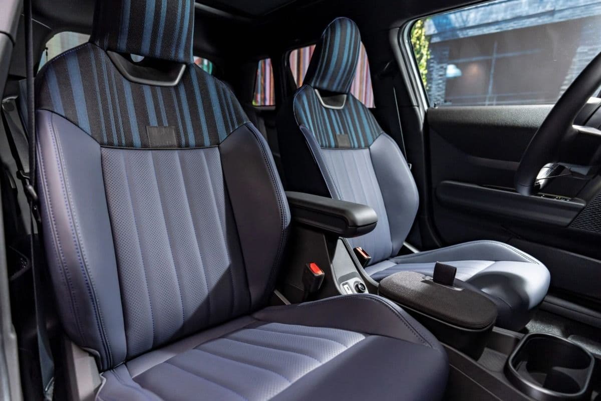 MINI Cooper SE Paul Smith Edition interior showing blue and grey striped vegan leather seats with black trim MINI Cooper SE Paul Smith Edition interior showing blue and grey striped vegan leather seats with black trim
