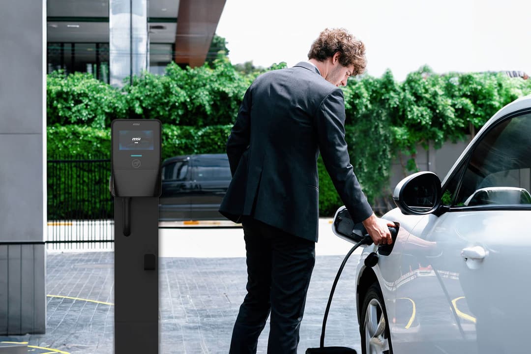man charging EV man charging EV
