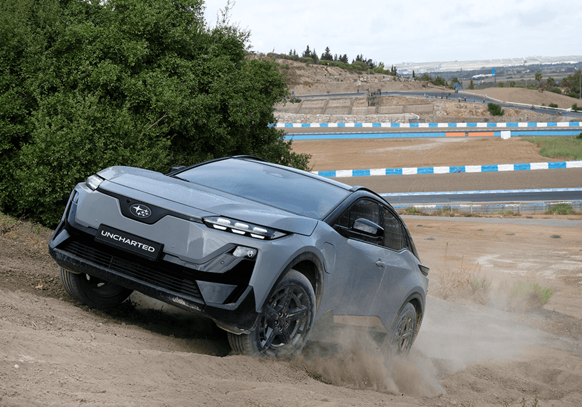 2026 Subaru Uncharted electric SUV accelerating on a dirt track, demonstrating dual-motor AWD performance 2026 Subaru Uncharted electric SUV accelerating on a dirt track, demonstrating dual-motor AWD performance