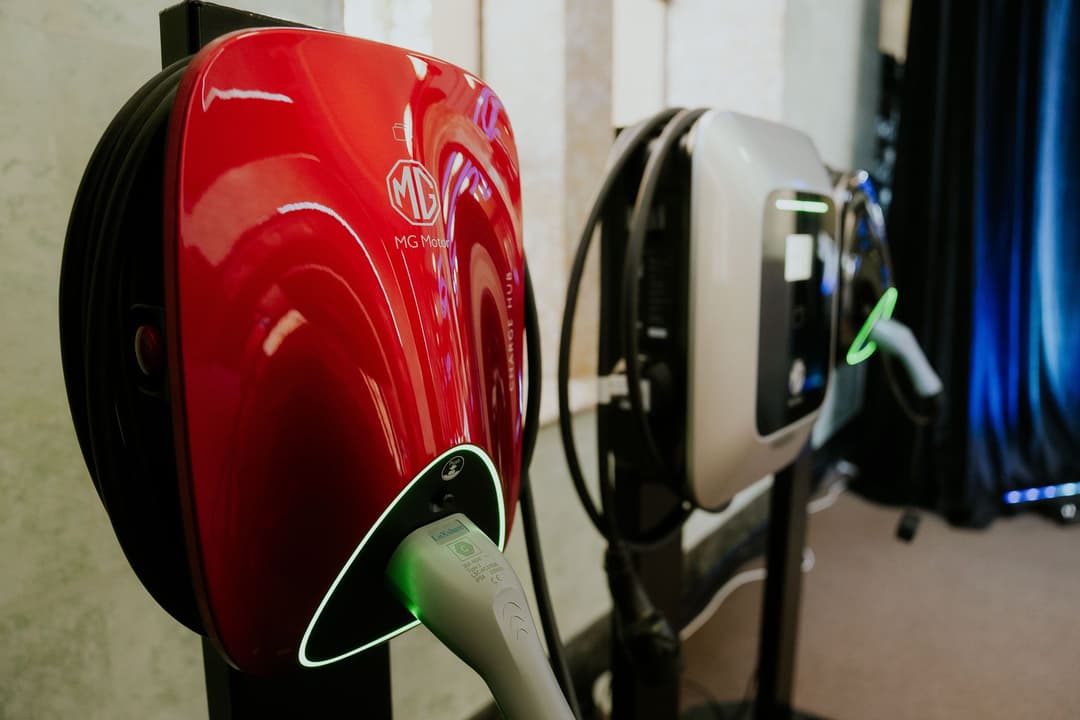MG wall box and Porsche Taycan at Destination Charger
