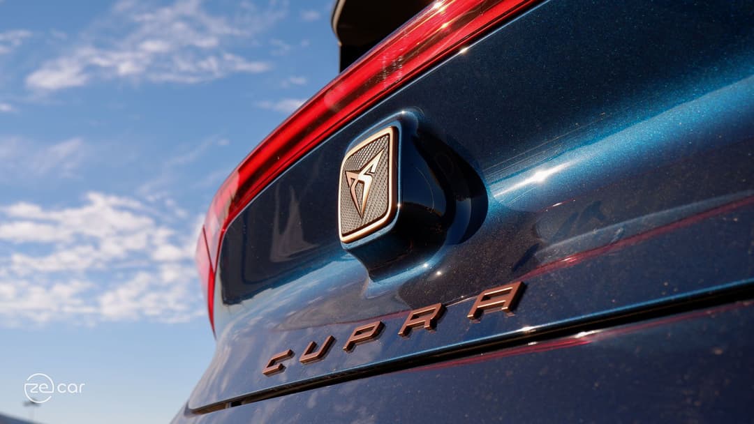 Cupra Born at charging station and rear Cupra logo